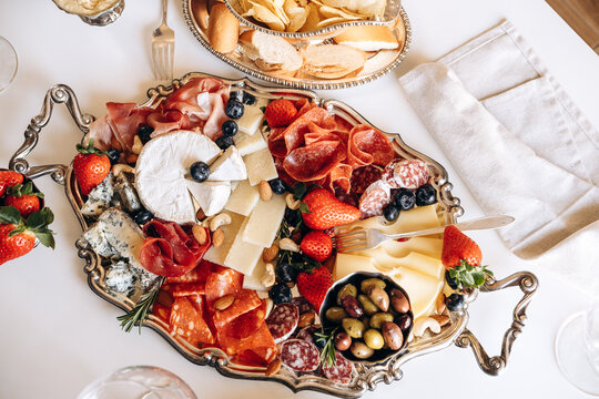 Elegant Charcuterie Board With Cheese, Cured Meats, Olives and Fresh Strawberries for Entertaining