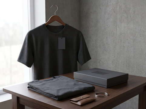 Black tshirt mockup with clothing box and accessories on a wooden table transparent background