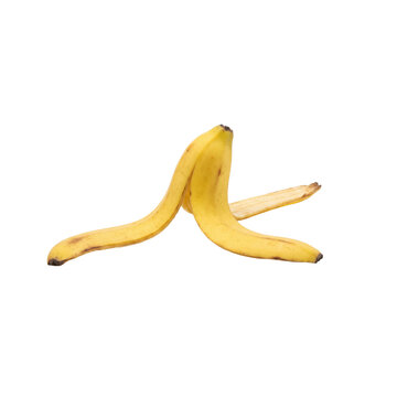 A single yellow banana peel lies on a white background, isolated
