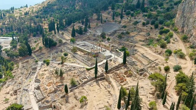 Delphi, Greece. Ruins of the ancient city of Delphi. Sunny weather, Summer. Drone footage, Departure of the camera
