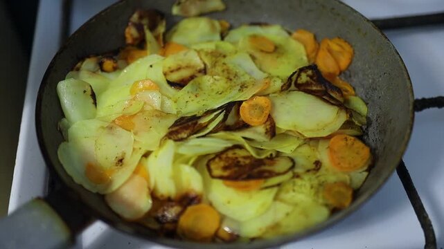 Cooking vegetables on a stove in a kitchen