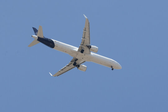 Lufthansa airbus a321 passenger plane flying in blue sky