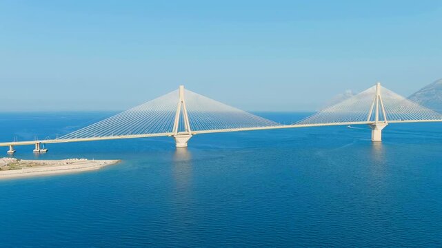 Patras, Greece. The Rio-Antirrio Bridge. Officially the Charilaos Trikoupis Bridge. Bridge over the Gulf of Corinth (Strait of Rion and Andirion). Drone footage, Departure of the camera