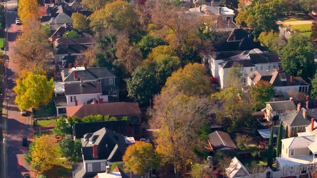 Old historic city architecture in Southern USA. View from above of Victorian mansions and streets of Macon, Georgia in colorful fall season.