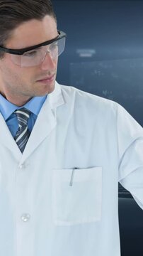 The doctor is touching an invisible screen, representing healthcare and medical technology