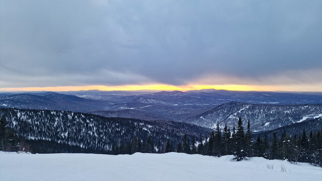 Beautiful winter sunset over the snowy landscape of Kopaonik in Raka District Serbia on a clear evening Stock Photo