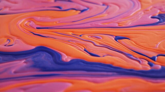 Abstract orange, pink, and blue marbled fluid pattern filling a colorful background
