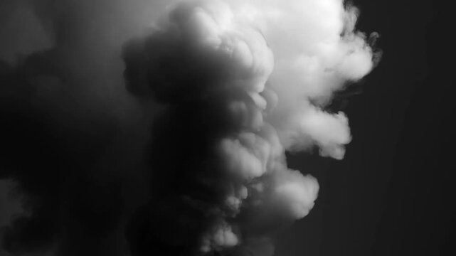 Billowing white smoke plume expands against dark background in monochrome scene