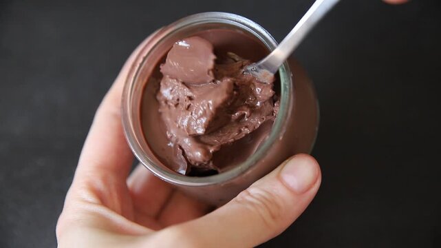 Chocolate pudding glass jar Chocolate mousse sweet dessert, natural ingredients food preparation tasty snack fresh gourmet food background on the table rustic food top view copy space