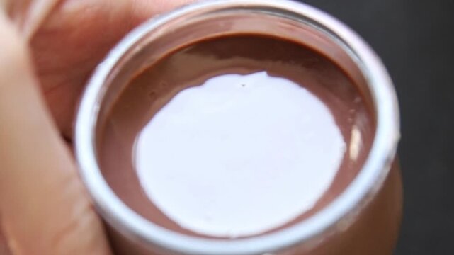 Chocolate pudding glass jar Chocolate mousse sweet dessert, natural ingredients food preparation tasty snack fresh gourmet food background on the table rustic food top view copy space