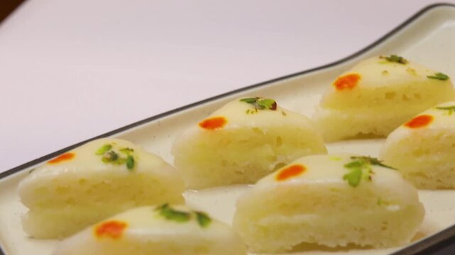 Malai sandwich or malai cham cham beautifully plated on white plate