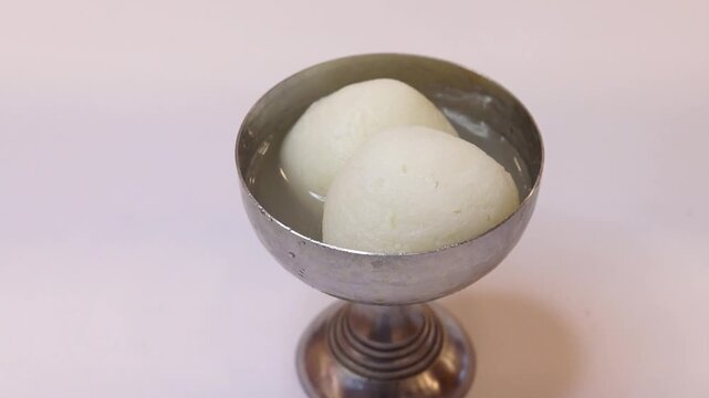 Rasgulla an indian dessert white balls dipped in sugar syrup