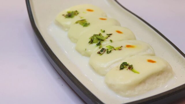 Malai cham cham sweet beautifully placed on white background 
