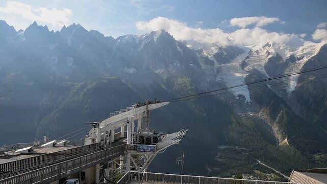 Mountain cable-car infrastructure beneath snow-covered Alpine peaks near Chamonix in the Mont Blanc massif, France.