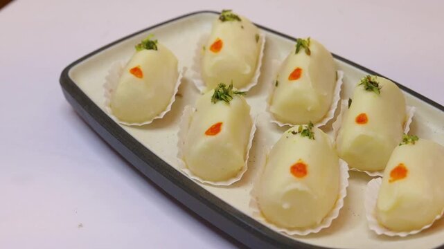 Malai cham cham sweet beautifully placed on white background 
