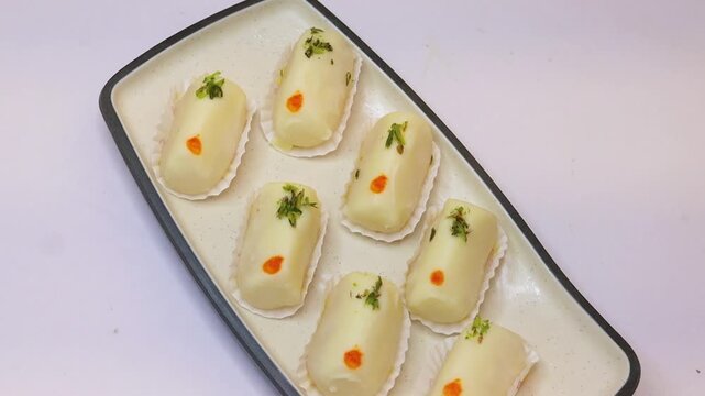 Malai cham cham sweet beautifully placed on white background 