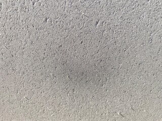 Fototapeta premium Close up of fine grey concrete pavement block surface with subtle porous details 