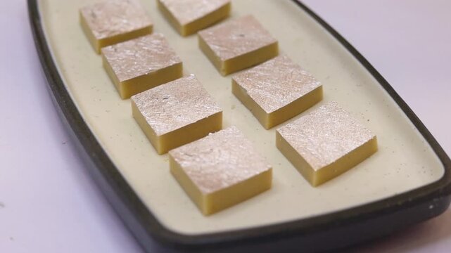 Kaju katli sweet plated on white plate