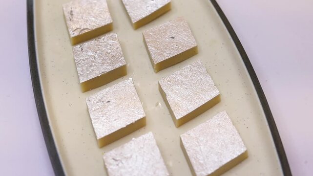 Kaju katli sweet plated on white plate