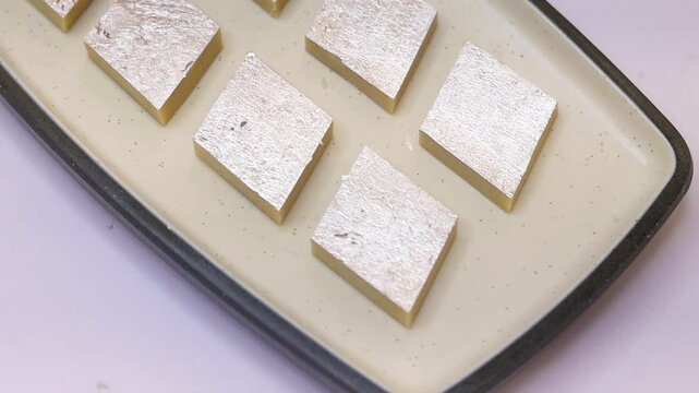 Kaju katli sweet plated on white plate