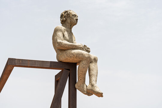 MORRO JABLE, FUERTEVENTURA &ndash; JULY 23, 2026: Granite and Corten steel sculpture El Poeta created by Amancio Gonzalez Andres in 2017 during the Pajara International Sculpture Symposium.