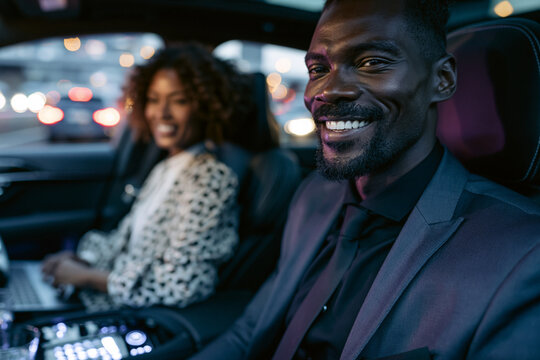Smiling Businessman and Colleague Commuting in Luxury Car