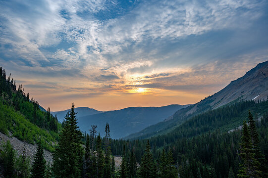 Colorful summer sunrise cloudscape over Castle Creek Valley near Aspen, Colorado.
