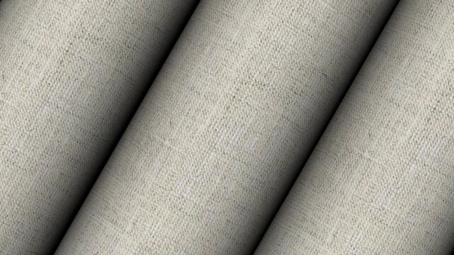 Revolving rolls of Italian meadow natural beige linen fabric showing organic eco friendly thread texture and premium summer apparel design background