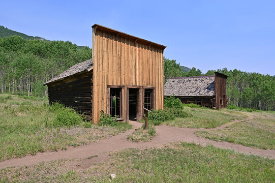 Long abandoned buildings of Ashcroft Ghost Town in Castle Creek Valley near Aspen, Colorado on sunny summer morning.
