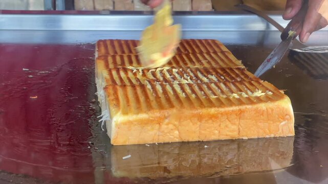 Grilling delicious sweet toasted bread on hot plate