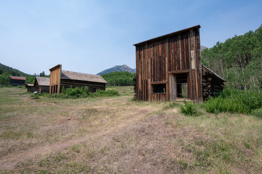 Long abandoned buildings of Ashcroft Ghost Town in Castle Creek Valley near Aspen, Colorado on sunny summer morning.