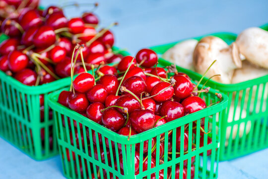 cherries in a basket in natural light with Sweet red fruit texture