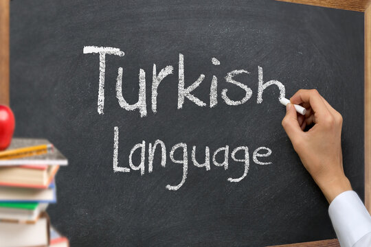 Hand writing Turkish language on blackboard
