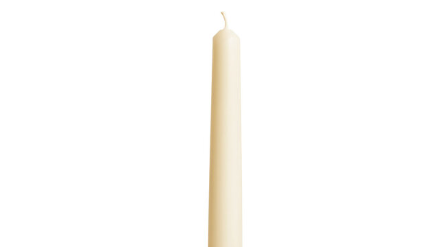 Single cream taper candle isolated on transparent background as png file for professional design projects