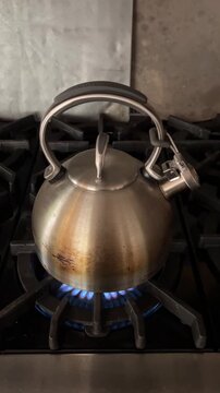 A kettle boiling on the stovetop