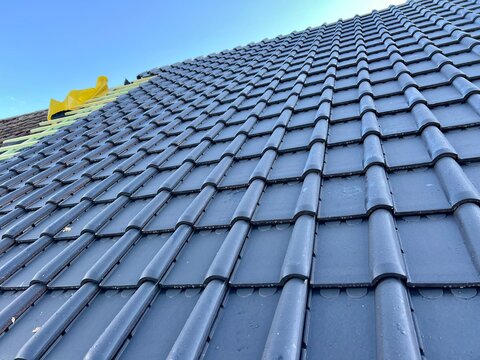 Roof repair installation of tiles construction work