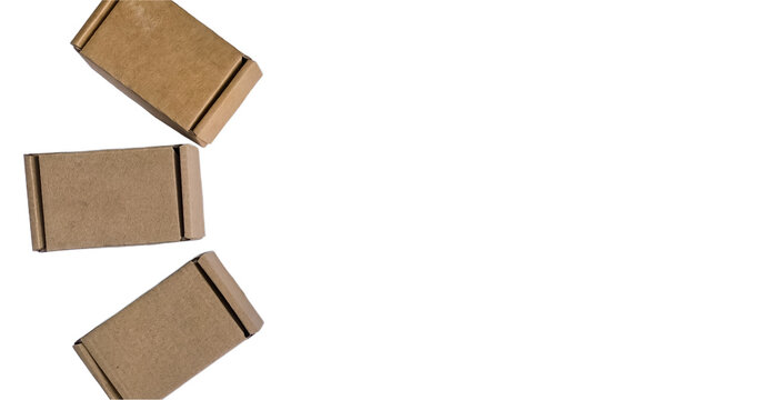 Fan layout of craft cardboard tuck top boxes with ears along left side on isolated white background.