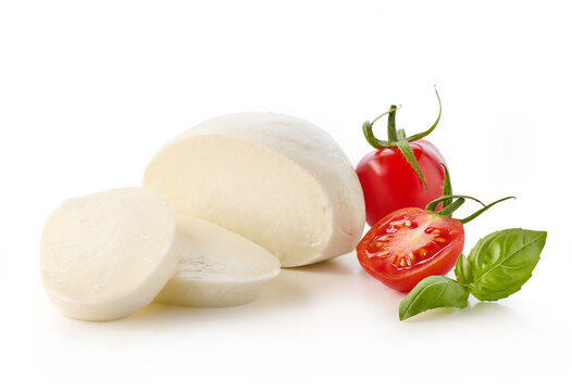 Fresh sliced Mozzarella cheese with cherry tomatoes and basil leaves on white background