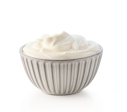 Gray ceramic bowl of fresh sour cream or greek yogurt