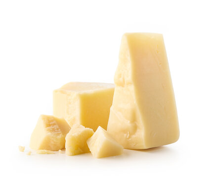 Different sizes of hard Parmesan cheese on white background