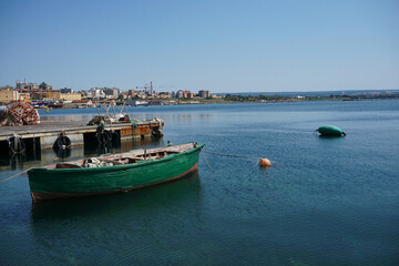 Fishing boat moored in the port of the old town of Taranto (Città vecchia), Puglia, Italy © kwiat7
