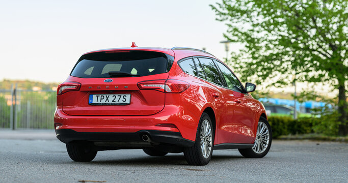 Gothenburg, Sweden - May 21 2026: Red Ford Focus estate wagon photographed from rear angle.