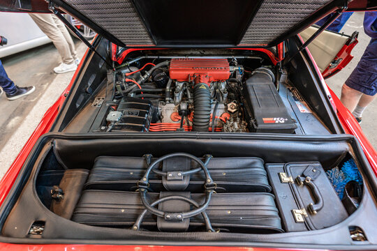Gothenburg, Sweden - May 30 2026: Ferrari Testarossa open rear compartment with luggage and engine.