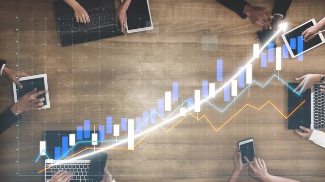 A collaborative business meeting showcases professionals engaged with digital devices, analyzing financial data and charting growth trends in a modern office setting. Copula