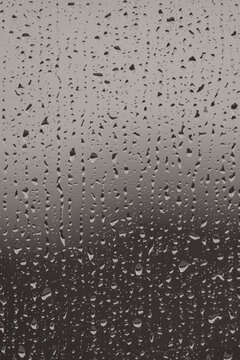 rain drops on window, minimastic moody grey background for the graphics design with copy space
