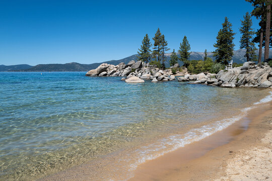 Sand Harbor State Park, Incline Village, Nevada, United States in August 2026. Crystal clear turquoise water and sandy beach shoreline with signature granite boulders.