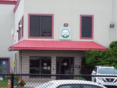 Gatineau, Quebec, Canada &ndash; June 26, 2026: The storefront of the "Soyarie" building features a red awning, brick and stucco exterior, tinted windows, and a parked car at 109 Bd Lorrain.
