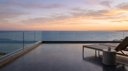 Fototapeta premium Luxury terrace with sunbed overlooking calm ocean during colorful sunset twilight