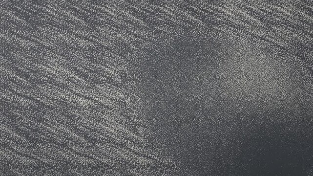 Thin Layer of Fine Grains Drifting Over a Flat Board with a Motionless Copy Space Zone, Seamless Loop in subtle slate tones