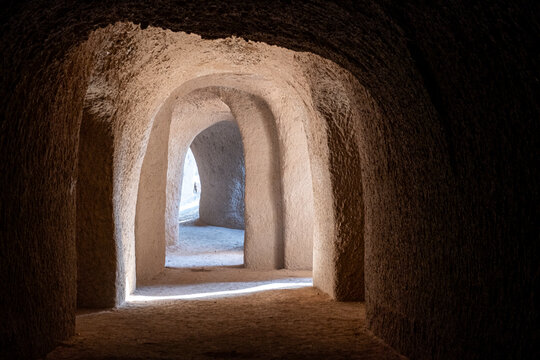 Light Shaft and Dust in Hand Carved Sand Tunnels Templo de Arena. VIllacorona, Jalisco. Mexico